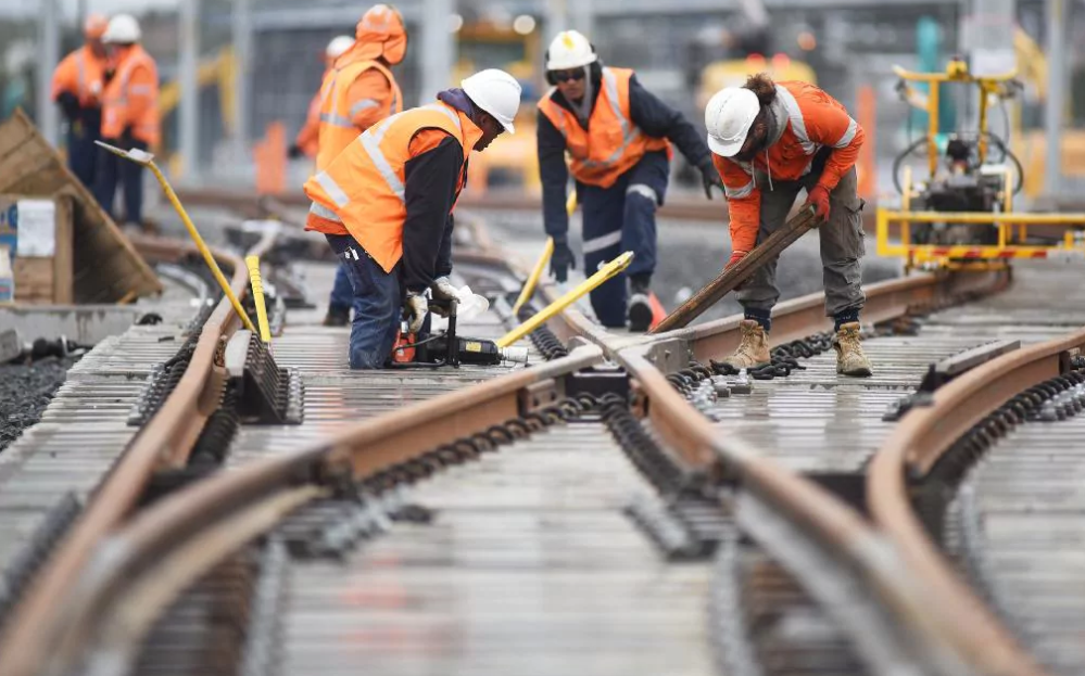 Case workers setting up train tracks