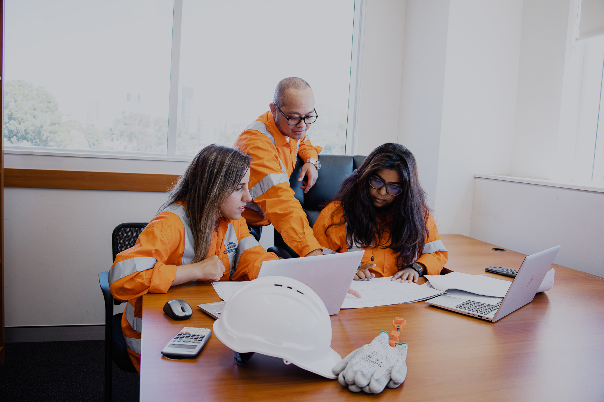 case civil engineers working on a project inside the office