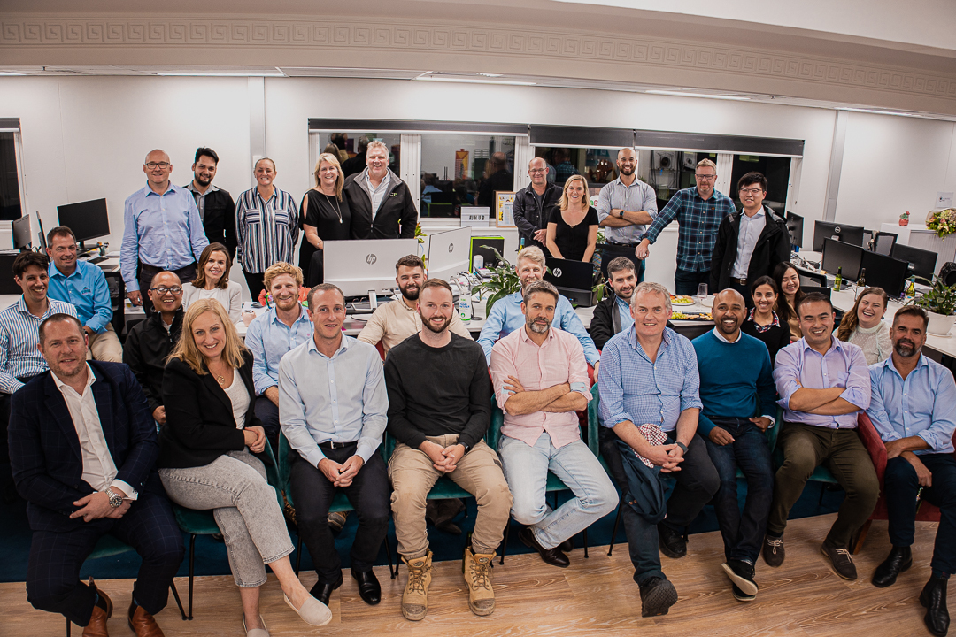 case civil and structural engineering corporate team group picture of engineers sitting in the office