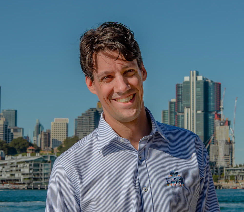 a corporate headshot portrait of civil structural design man engineer florian dieterle in front of sydney city