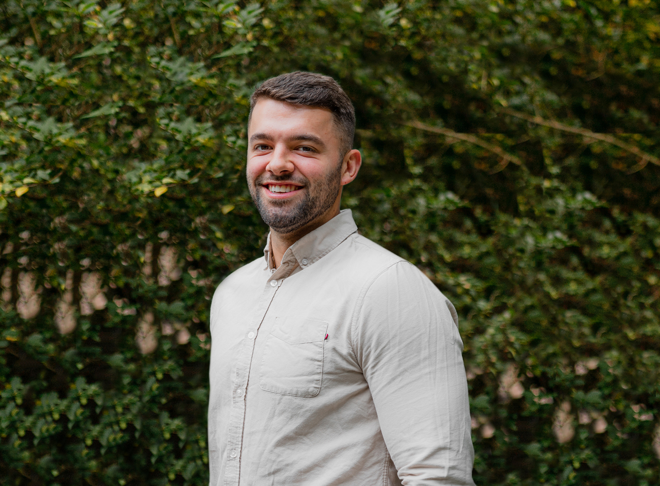 a corporate headshot portrait of civil structural design man engineer graham southall in front of trees